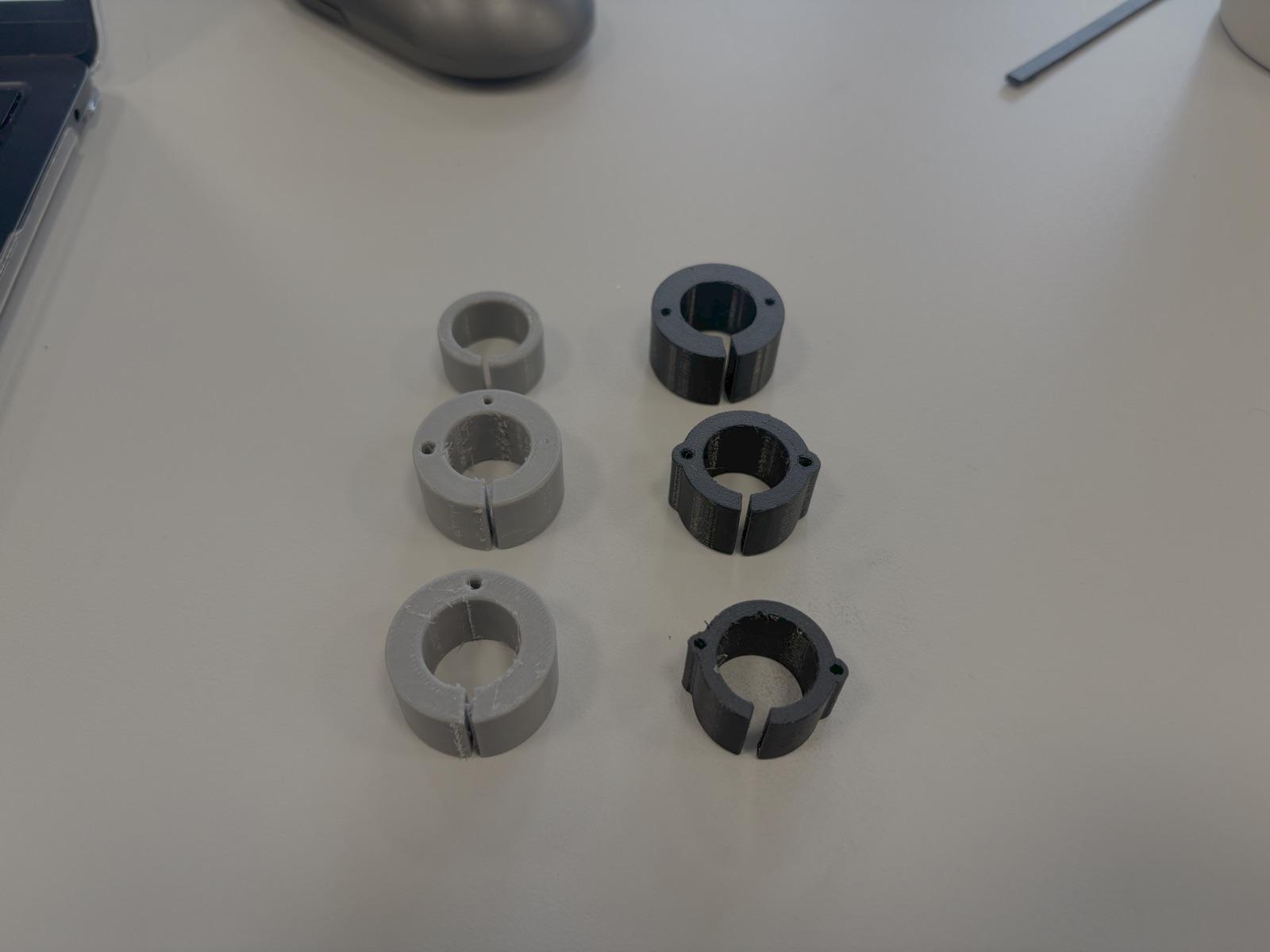 Six early 3D-printed ring concepts arranged on a workbench