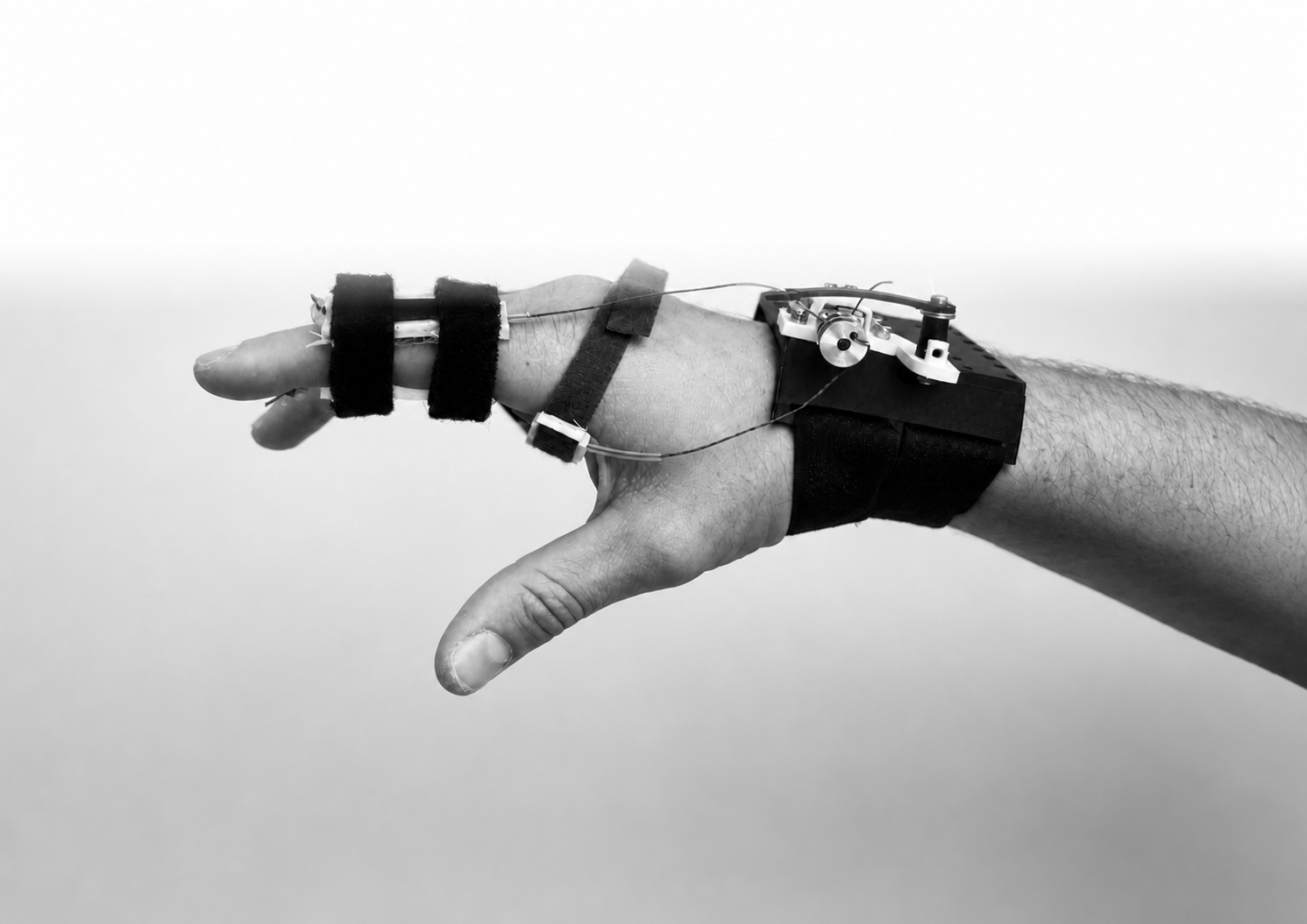 Finished wearable soft-finger actuator on a hand